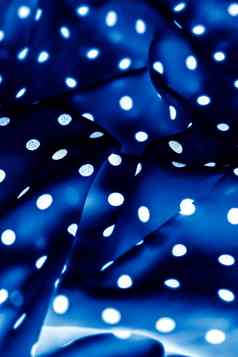 经典波尔卡点纺织背景纹理白色点蓝色的奢侈品织物设计模式