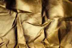 金箔纹理闪亮的折叠摘要黄金背景