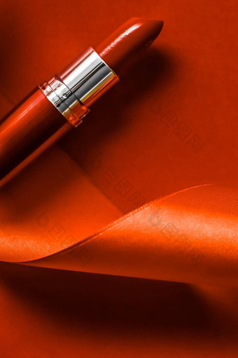 奢侈品口<strong>红丝绸</strong>丝带橙色假期背景化妆化妆品平铺美品牌产品设计