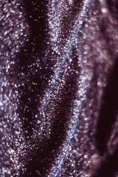 紫色的假期闪闪发光的闪闪发光的摘要背景奢侈品闪亮的织物材料魅力设计节日邀请