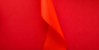 摘要卷曲的丝绸丝带红色的背景独家奢侈品品牌设计假期出售产品促销活动魅力艺术邀请<strong>卡</strong>背景