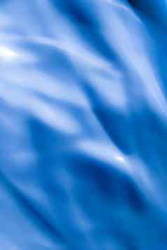 蓝色的摘要艺术背景丝绸纹理波行运动经典奢侈品设计