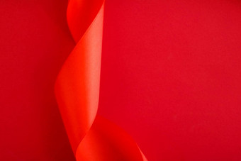 摘要卷曲的丝绸丝带红色的背景独家奢侈品品牌设计假期出售产品促销活动魅力艺术邀请卡背景