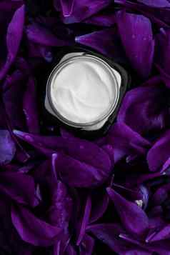 奢侈品脸奶油保湿霜面部皮肤紫色的花背景花散文水疗中心化妆品美乳状液护肤品品牌产品