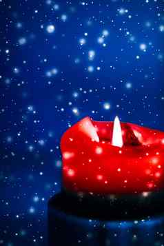 红色的假期蜡烛蓝色的闪闪发光的下雪背景奢侈品品牌设计圣诞节年夏娃情人节一天