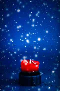 红色的假期蜡烛蓝色的闪闪发光的下雪背景奢侈品品牌设计圣诞节年夏娃情人节一天