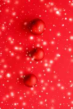 圣诞节装饰物红色的背景雪闪闪发光的奢侈品冬天假期卡