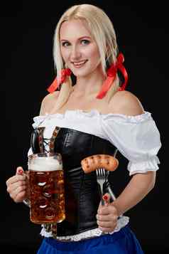 女服务员传统的德国服装持有啤酒玻璃啤酒节
