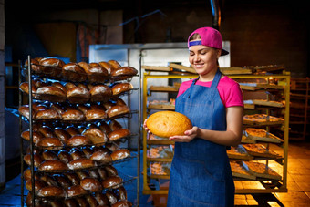 贝克女孩需要热面包面包<strong>店</strong>背景搁置面包工业生产面包阶段烘焙面包<strong>店</strong>