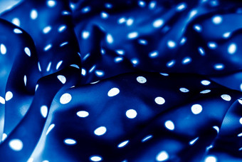 经典波尔卡点纺织背景纹理白色点蓝色的奢侈品织物设计模式