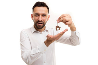 男人。房地产经纪人白色衬衫论证地持有钥匙链房子手概念财产保险真正的房地产服务银行贷款住宅商业真正的房地产