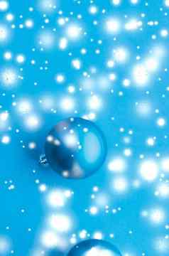 圣诞节装饰物蓝色的背景雪闪闪发光的奢侈品冬天假期卡