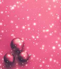 圣诞节装饰物粉红色的背景雪闪闪发光的奢侈品冬天假期卡
