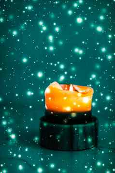 橙色假期蜡烛绿色闪闪发光的下雪背景奢侈品品牌设计万圣节年夏娃圣诞节