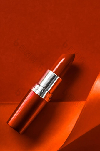 奢侈品口红丝绸丝带橙色假期背景化妆化妆品平铺美品牌产品设计
