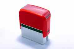 红色的办公室自动橡胶邮票孤立的白色