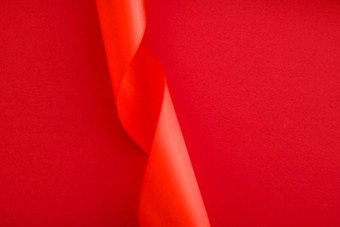 摘要卷曲的丝绸丝带红色的背景独家奢侈品品牌设计假期出售产品促销活动魅力艺术邀请<strong>卡</strong>背景