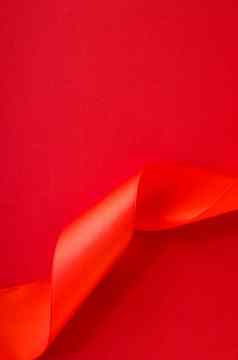 摘要卷曲的丝绸丝带红色的背景独家奢侈品品牌设计假期出售产品促销活动魅力艺术邀请卡背景