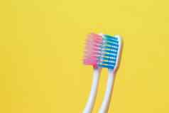 牙刷粉红色的蓝色的牙刷概念夫妇生活开始家庭