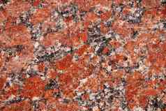 红色的花岗岩瓷砖纹理关闭自然花岗岩纹理背景抛光装饰石头照片设计宏红色的灰色花岗岩装饰瓷砖背景设计模式