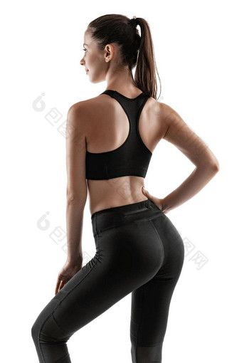 浅黑肤色的女人女人黑色的紧身裤前运动鞋摆姿势孤立的白色健身健身房健康的生活方式概念