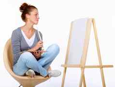 等待灵感罢工工作室拍摄年轻的女艺术家坐着椅子空白帆布