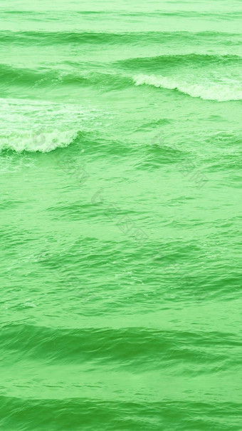 真正的照片海水波摘要背景自然权力明亮的绿色语气股票