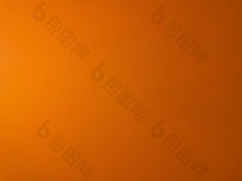 橙色彩色的背景明亮的摘要纹理画水泥墙