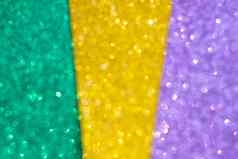 摘要散焦闪亮的背景黄金绿色紫色的經酱节日传统的颜色背景发光闪闪发光的經酱庆祝活动