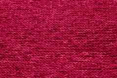 还活着品红色的健美的颜色单色纹理针织织物黑暗粉红色的针织泽西岛纺织背景单色颜色背景羊毛针织纹理时尚的颜色
