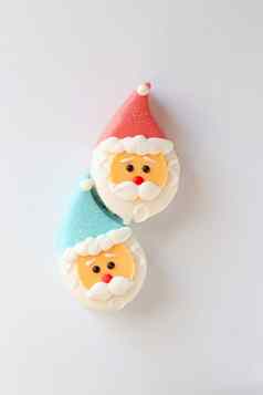 甜蜜的甜点形式圣诞老人老人头红色的蓝色的帽