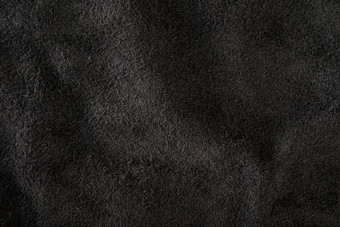 黑色的仿麂皮特写镜头自然黑色的仿麂皮纹理设计项目天鹅绒皮革反向