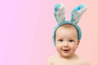 可爱的有趣的婴儿兔子耳朵彩色的背景复活节问候卡婴儿复活节兔子