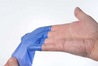 医生需要蓝色的橡胶手套皮肤手皱纹水分皱纹手指穿橡胶手套长时间