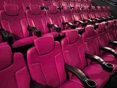 电影娱乐空粉红色的电影剧院座位显示流媒体服务电影行业生产