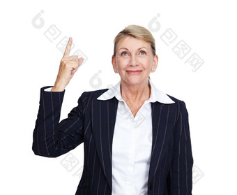 高级业务女人微笑指出手指白色背景建议产品放置模型上了年纪的人快乐脸企业经理手手势孤立的工作室