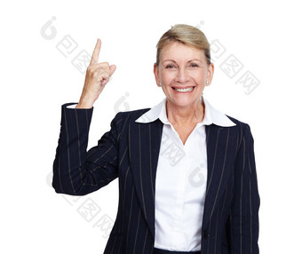 高级女商人微笑肖像指出手指白色背景建议产品放置模型上了年纪的人快乐脸经理手手势孤立的工作室
