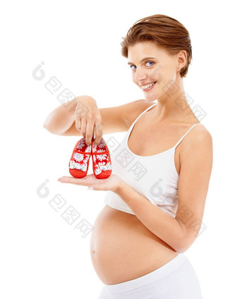 婴儿鞋子怀孕了女人妈妈。肖像快乐微笑怀孕胃年轻的健康的幸福妈妈兴奋服装婴儿母亲家庭护理孩子