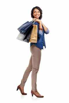 时尚购物黑色的女人快乐微笑工作室白色背景市场营销模型空间衣服出售女孩客户购物袋折扣交易促销提供