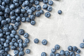 新鲜的蓝莓灰色的背景蓝莓背景健康的浆果有机食物抗氧化剂维生素蓝色的食物