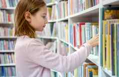 漂亮的女孩孩子阅读书图书馆