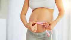 日益增长的英寸英寸周周怀孕了女人测量肚子首页