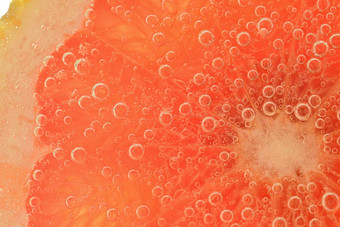 片葡萄柚闪闪发光的水葡萄柚片覆盖泡沫碳酸水葡萄柚片水泡沫