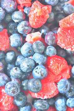 冻新鲜的蓝莓树莓特写镜头特写镜头视图越桔树莓纹理冻浆果平设计前视图垂直图像