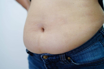 亚洲女人显示脂肪肚子大大小超重肥胖办公室
