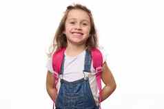 孤立的肖像白色背景学校孩子女孩粉红色的背包精明地微笑相机
