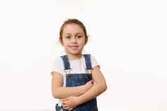 情感肖像可爱的婴儿女孩穿蓝色的牛仔布工作服孤立的白色背景复制空间