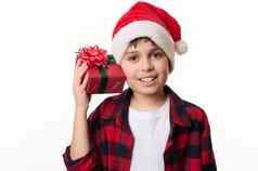 可爱的孩子男孩圣诞老人他摇礼物盒子猜测现在内部微笑相机快乐冬天假期