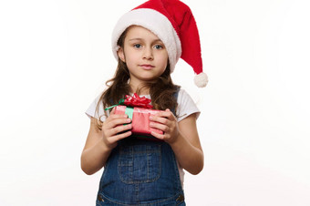 美丽的孩子女孩穿圣诞老人他牛仔布工作服持有快乐圣诞节现在相机