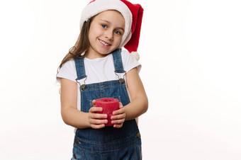 迷人的女孩圣诞老人他牛仔布工作服摆姿势白色背景红色的蜡烛手